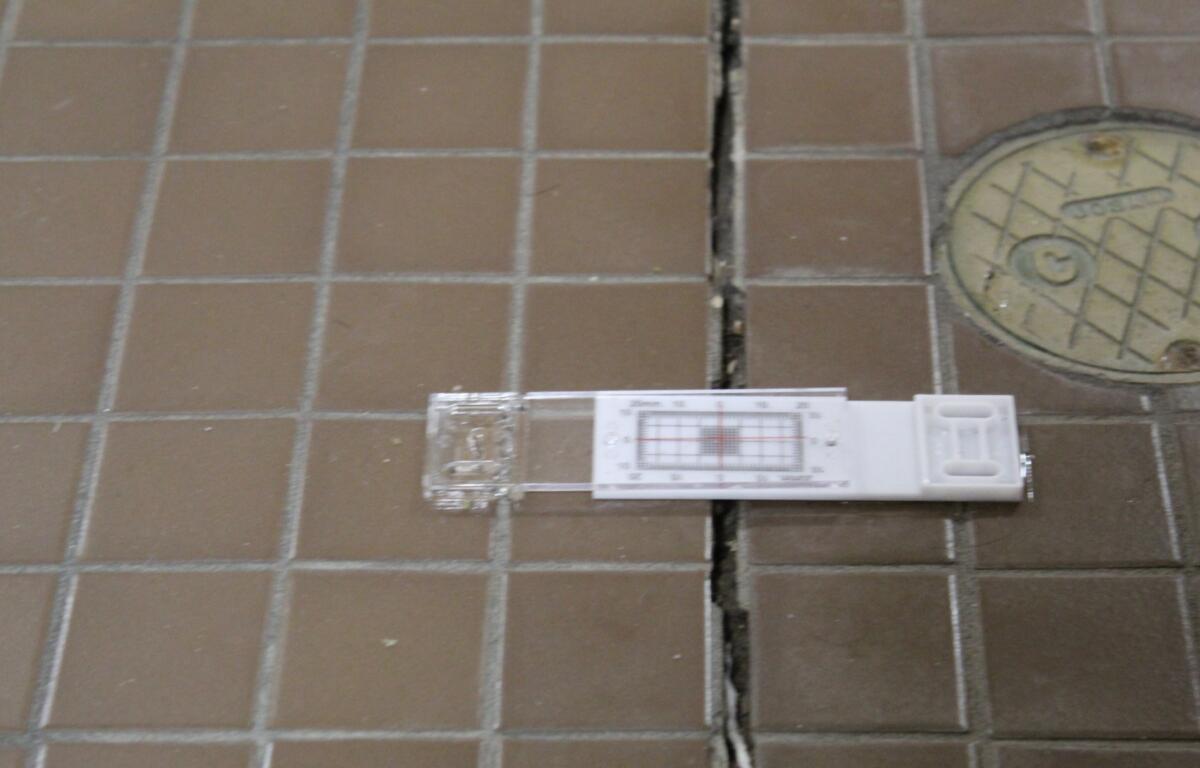 Black Mountain Police Chief Steve Parker says gauges have been installed on cracks in the bathroom floor to monitor their growth.