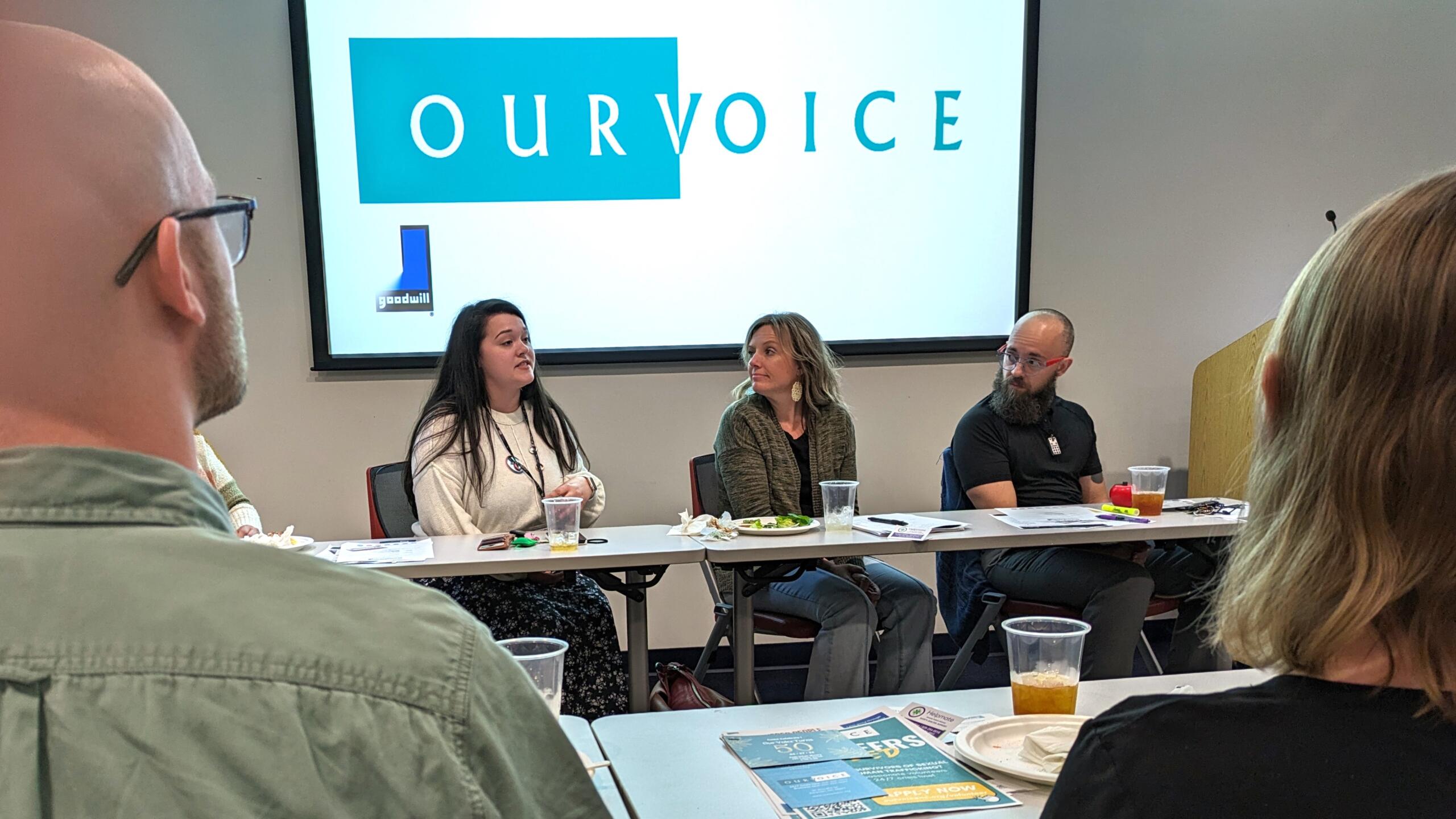 Becca LeBouef of the non profit group Our Voice sits at a table discussing her group's programs during a Business Advisory Council meeting on March 7, 2024, at the Goodwill Career Center in Asheville.