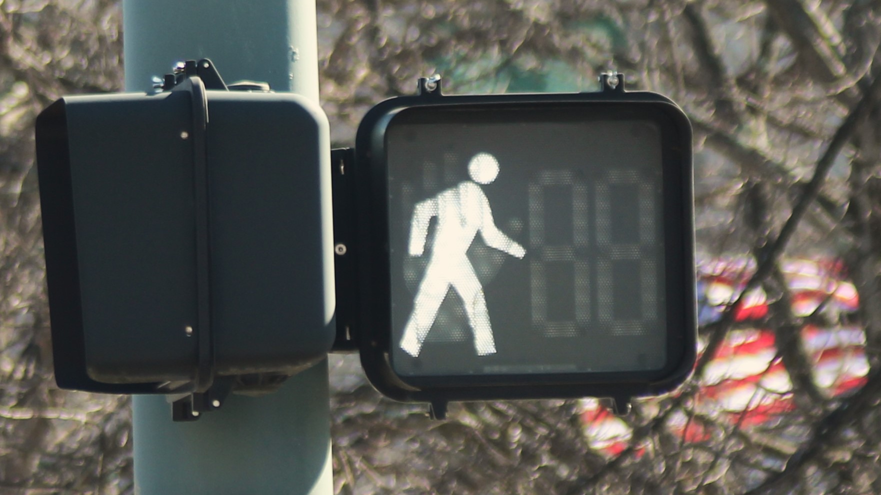 A pedestrian street sign