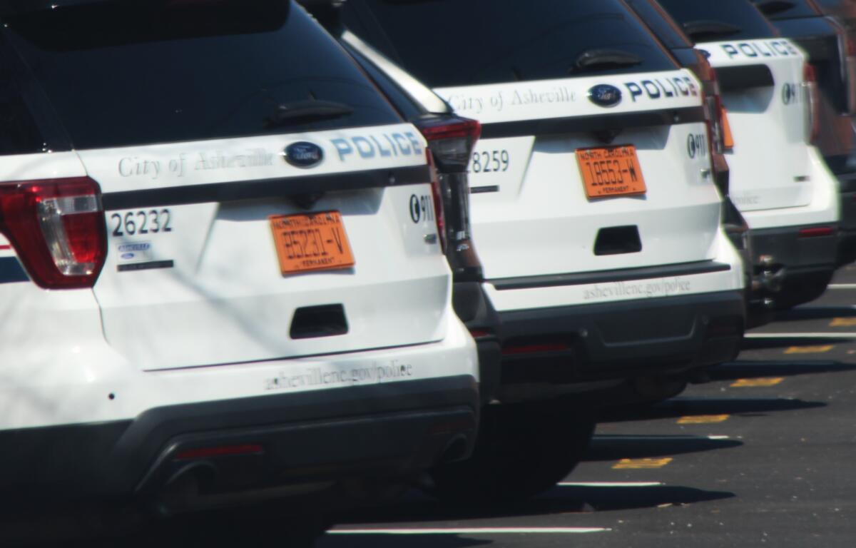 Asheville Police cars are lined up in downtown Asheville, N.C., in February 2024.