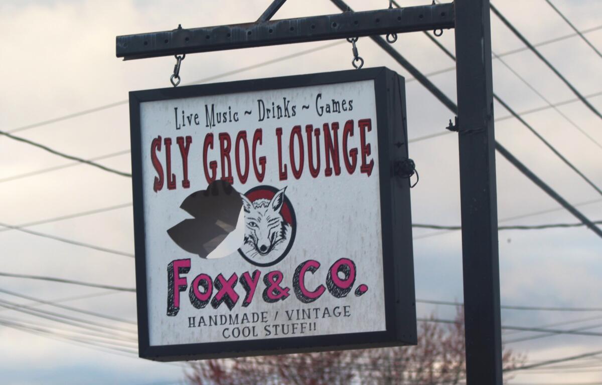 A damaged Sly Grog Lounge sign still hangs outside the fire damaged building as owners prepare for a re-opening on May 17, 2024.
