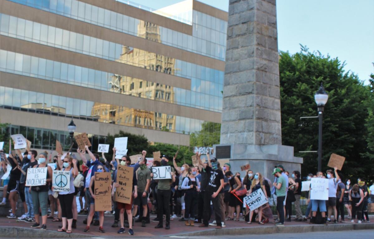 FILE: Black Lives Matter protesters surround the Vance Monument in the summer of 2020.