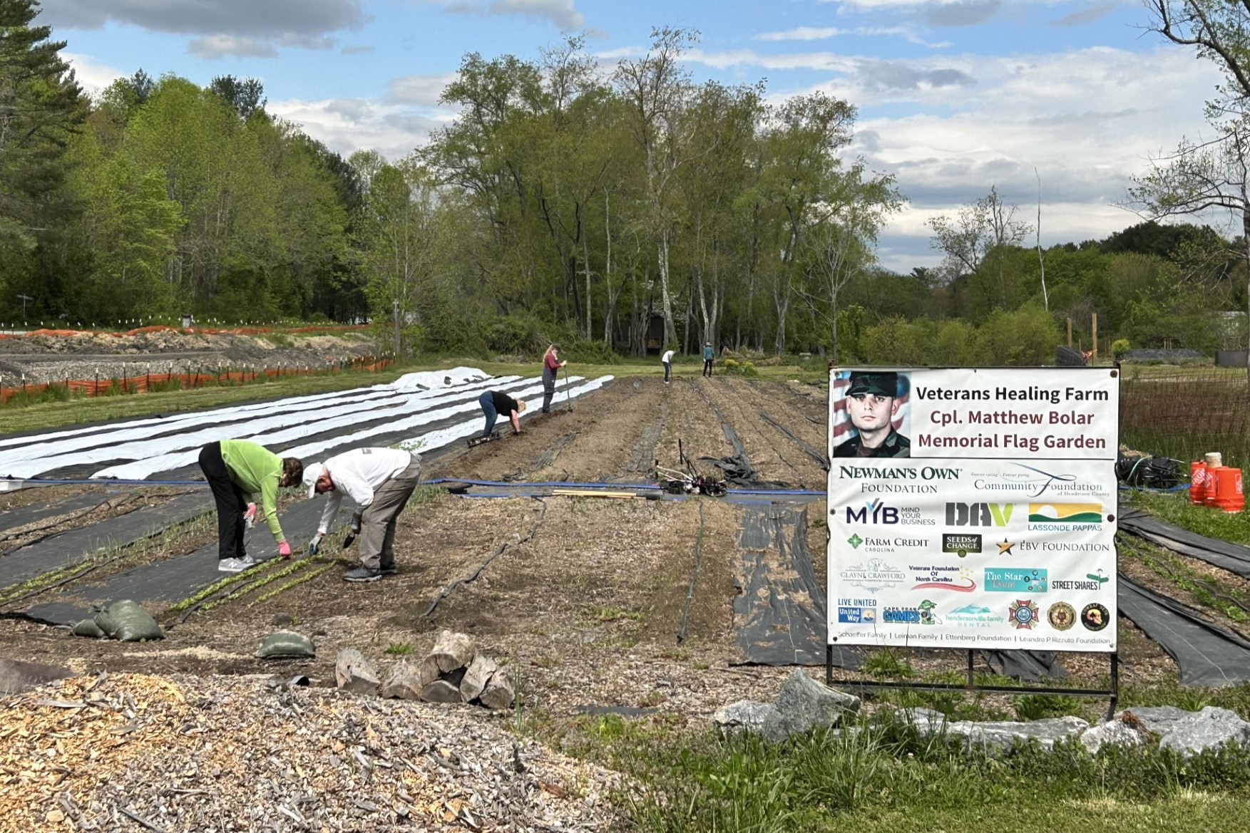 A crew cooperates to prepare the gardens on Wednesday, April 24, at the Veterans Healing Farm in Henderson County. The farm needs help to find land and funding for a new home.