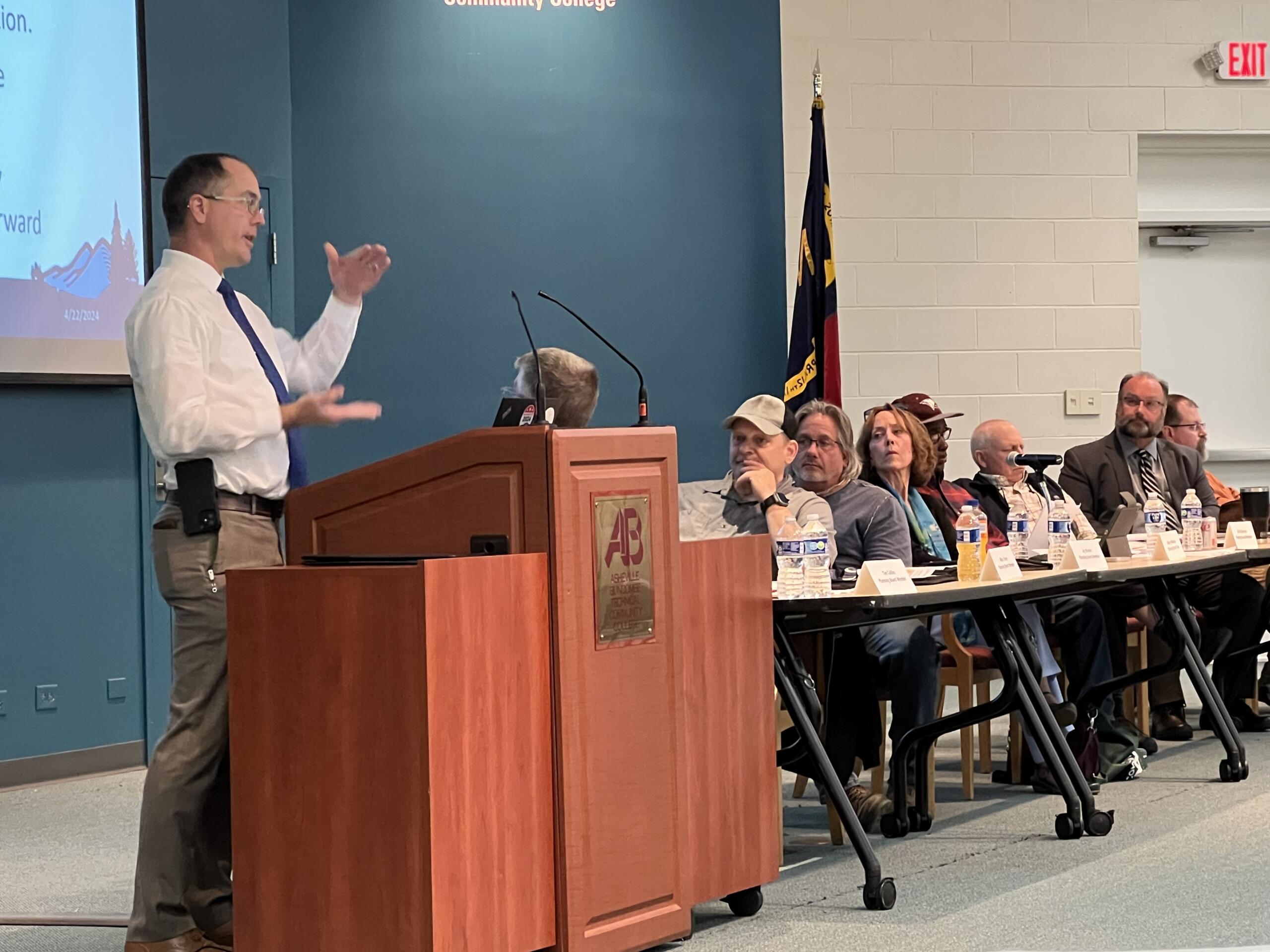 Buncombe County Planning Director Nathan Pennington addresses the crowd Monday, April 22, during the county Planning Board's consideration of regulations on short-term rentals at A-B Tech's Ferguson Auditorium in Asheville.