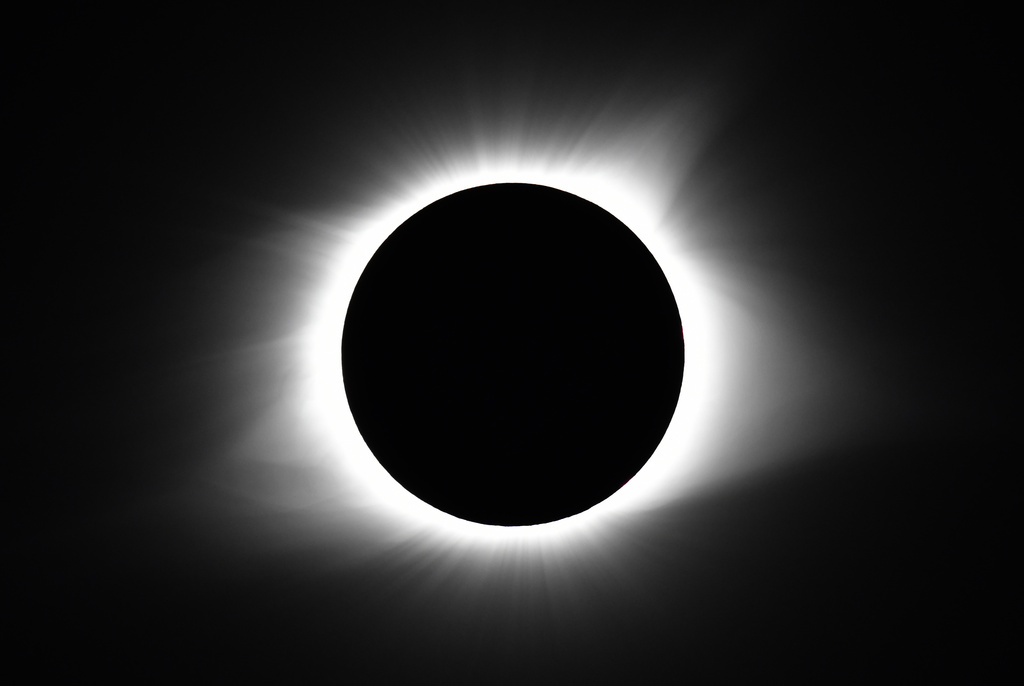 Even with a chance of partly-cloudy skies over Western North Carolina, science fans are hoping to get a view of Monday's partial eclipse that's even close to this Associated Press file photo from Aug. 21, 2017, over Cerulean, Kent. Protective eyewear is a must, experts say.