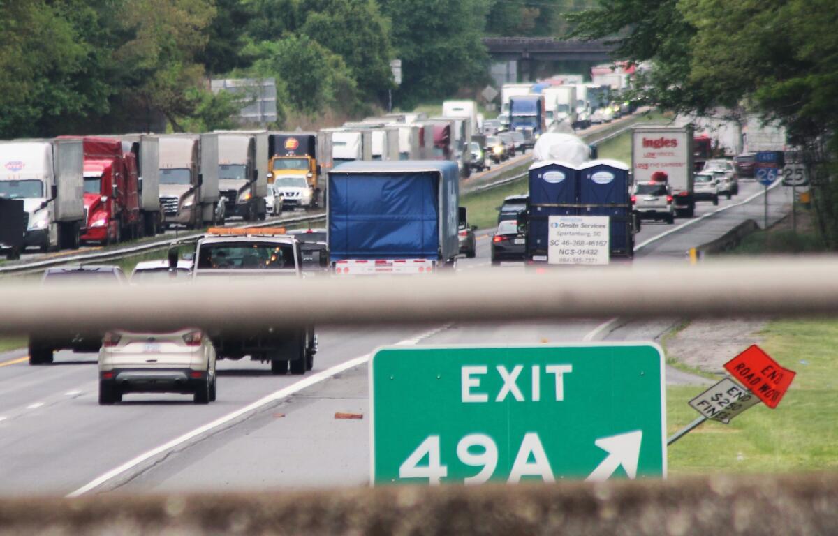 Interstate 26 traffic around Hendersonville was clogged from the morning well into the afternoon Tuesday after a fiery non-injury accident in a construction zone near exit 49B.