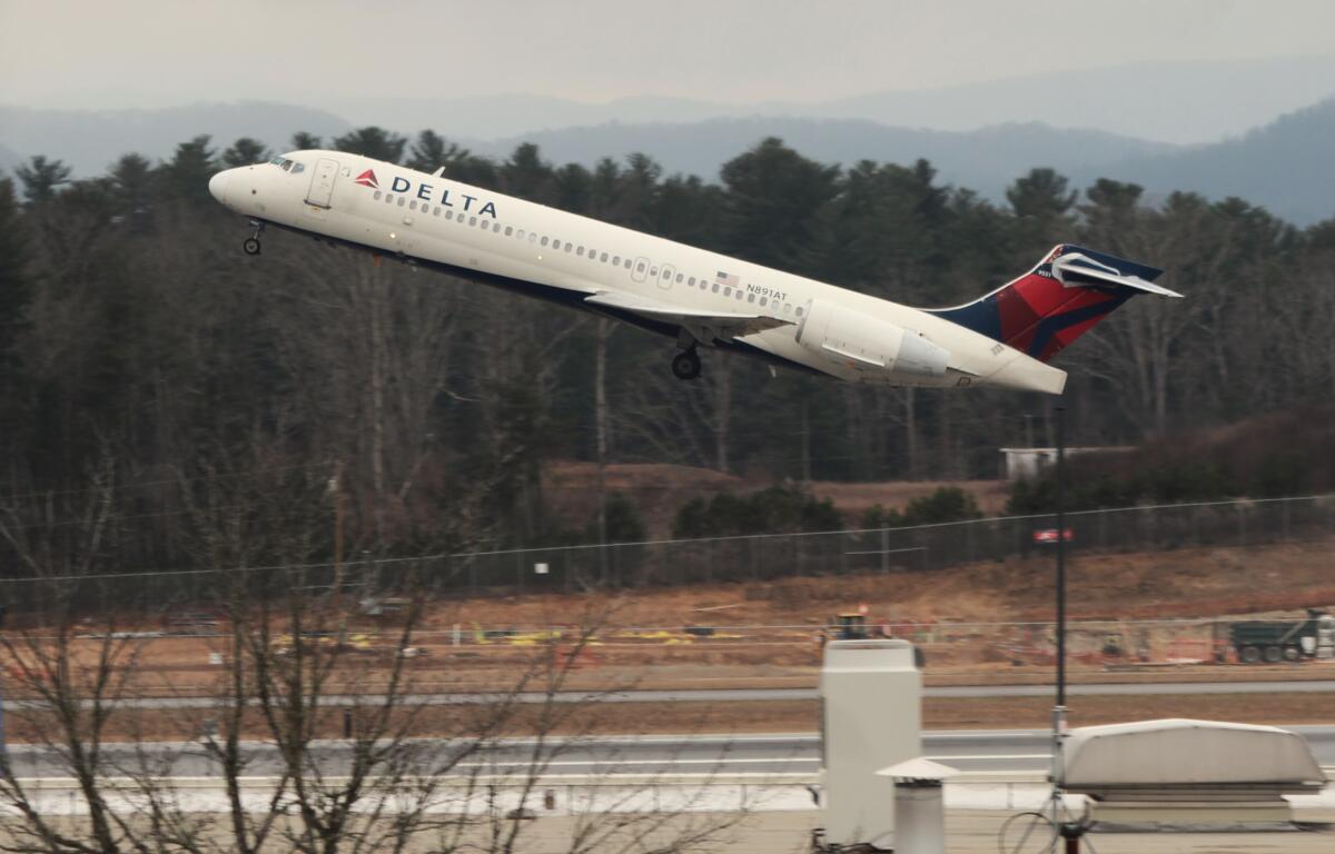 A flight departs in February 2024 from Asheville Regional Airport, where passenger use figures have been soaring and a massive expansion plan is underway.