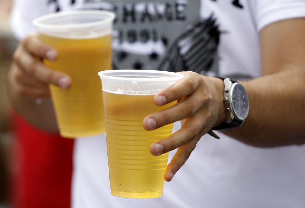 As in this AP file photo from 2009 in Kissimmee, Fla., people soon might be able to buy beer in to-go cups and stroll through a "social district" in Black Mountain -- if the Town Council approves creating the district.