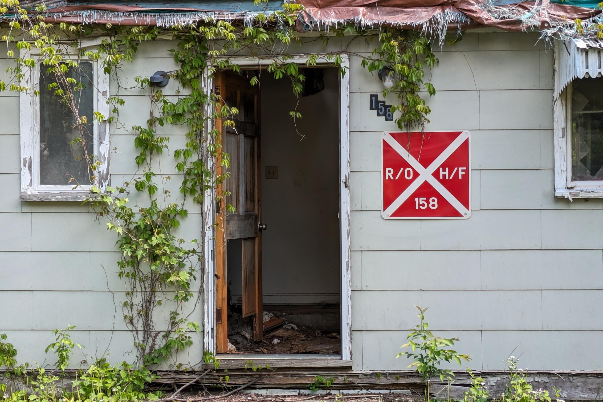 The Asheville City Council has agreed to spend $28,000 to demolish a notorious abandoned home at 158 South French Broad Ave.