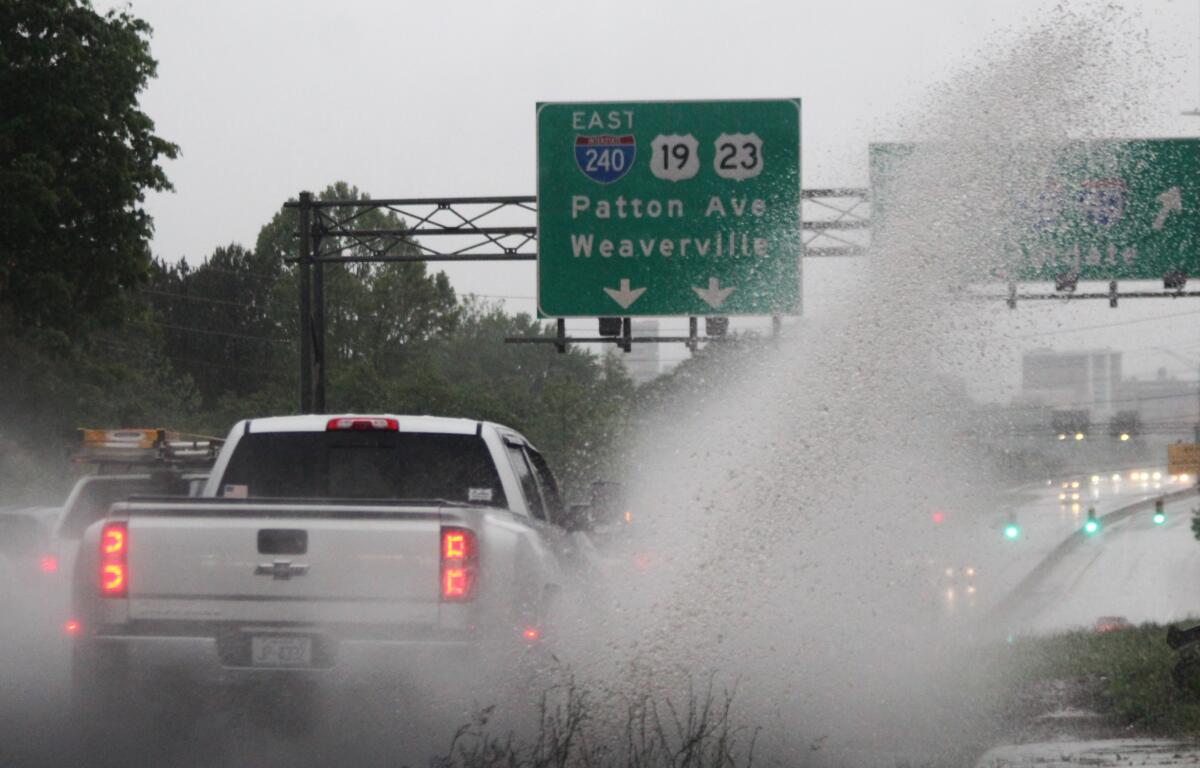 Thunderstorms during the morning rush hour created slow, difficult driving conditions on the Patton Avenue bridge in Asheville and throughout the region on Thursday, May 9, 2024.