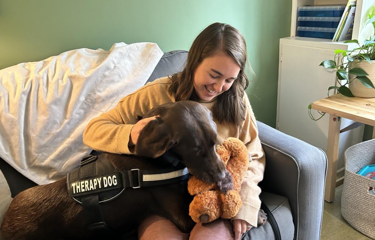 Crossnore Crossnore Child and Family Therapy Supervisor Betsy Neill and Norm, the emotional support dog
