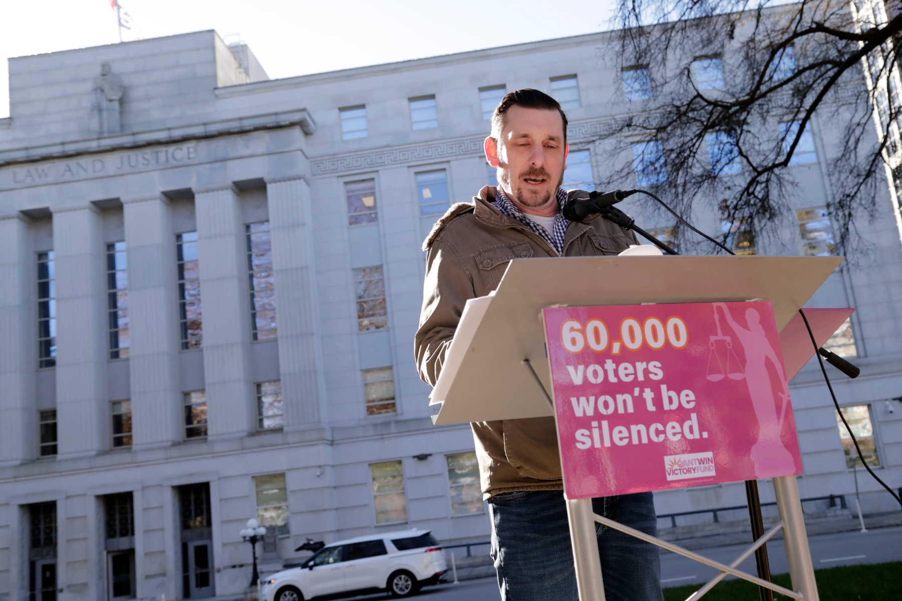 Ted Corcoran reads names from a list of over 60,000 people who cast ballots in the November 2024 election but whose votes have been challenged by Republican state Supreme Court candidate Jefferson Griffin in his extremely close race with Demcoratic Associate Justice Allison Riggs, Tuesday, Jan. 14, 2025, in Raleigh, N.C. Behind him is the North Carolina Supreme Court. (AP Photo/Chris Seward)