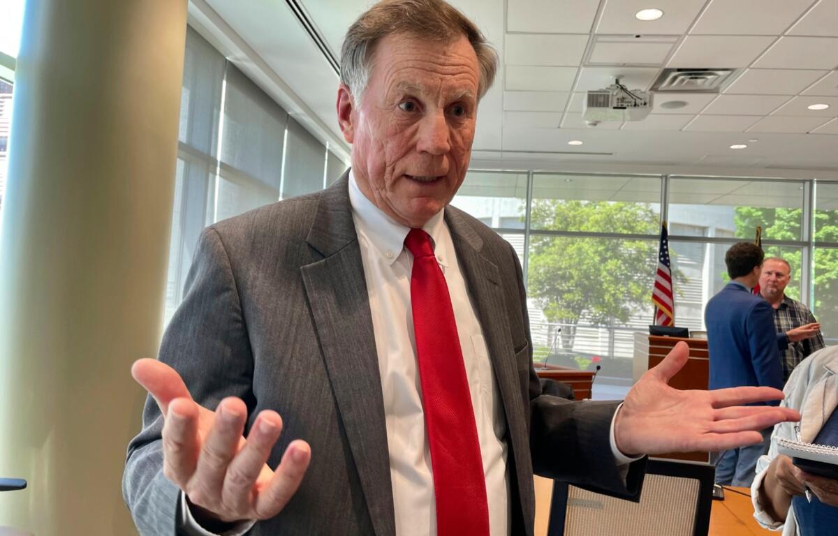 FILE - North Carolina Insurance Commissioner Mike Causey talks to reporters at the Albemarle Building in Raleigh, N.C., April 24, 2023. (AP Photo/Hannah Schoenbaum, file)