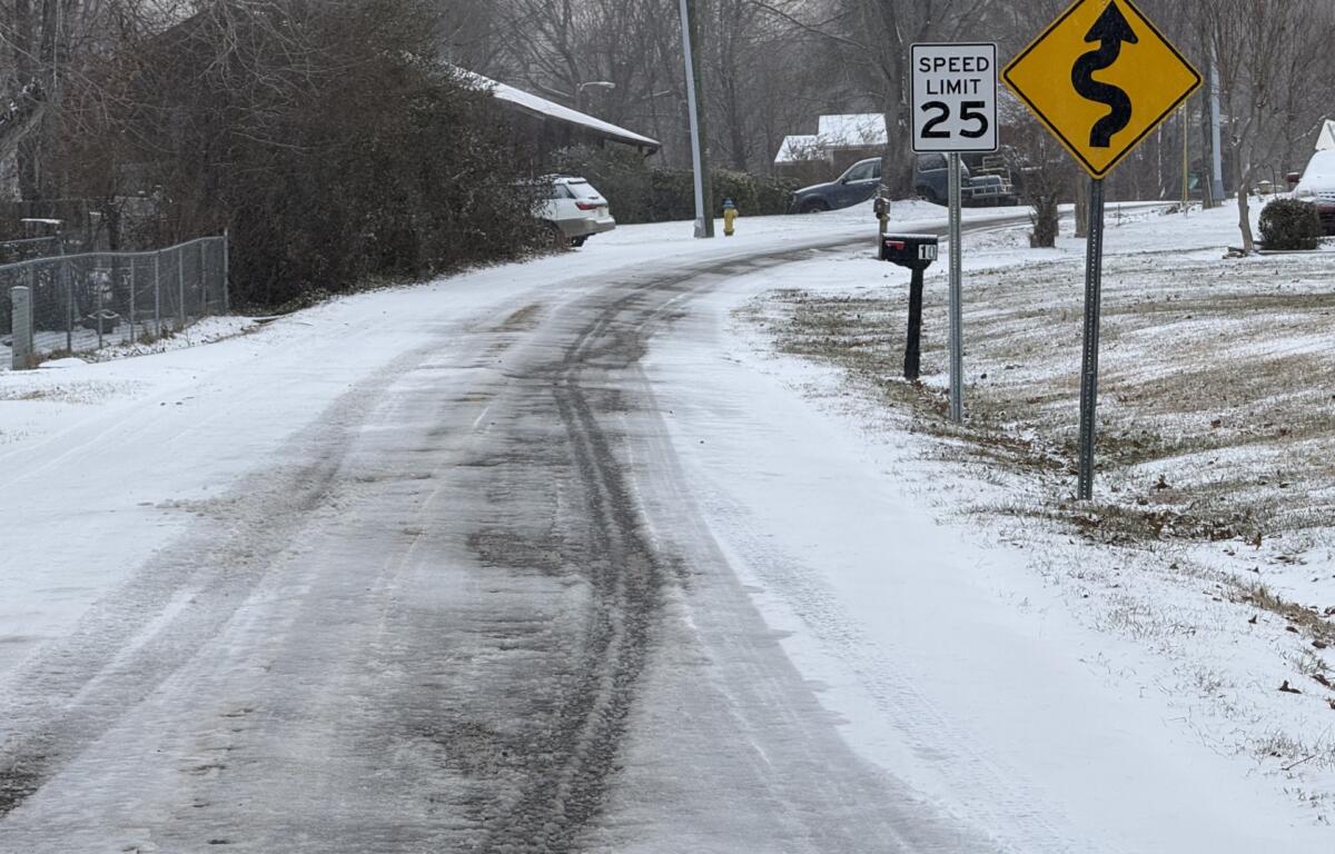 Candler Knob Road covered in snow and ice Saturday morning, Jan. 11, 2025.