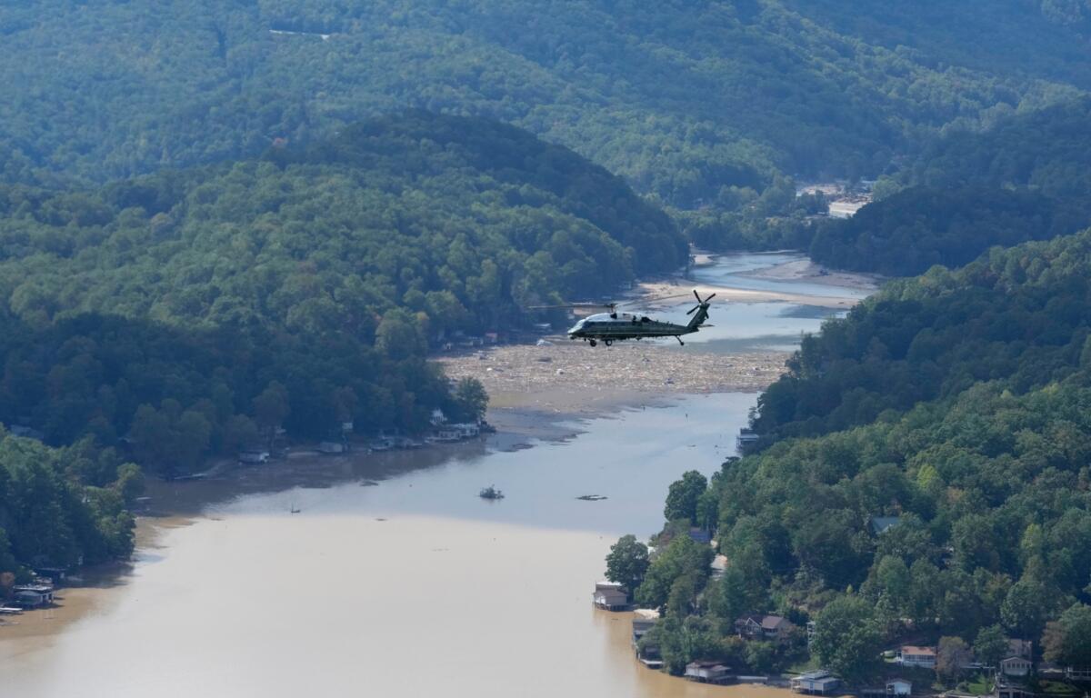 Marine One, with President Joe Biden on board, flies over Lake Lure and around areas impacted by Hurricane Helene near Chimney Rock, N.C., Wednesday, Oct. 2, 2024. (AP Photo/Susan Walsh)