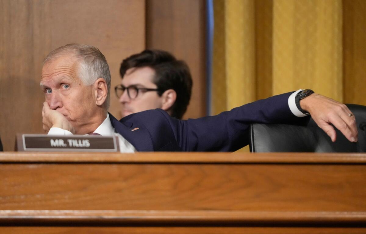 Sen. Thom Tillis, R-N.C., listens as U.S. Trade Representative Jamieson Greer as he testifies before the Senate Finance Committee on Capitol Hill in Washington, Tuesday, April 8, 2025. (AP Photo/Mark Schiefelbein)