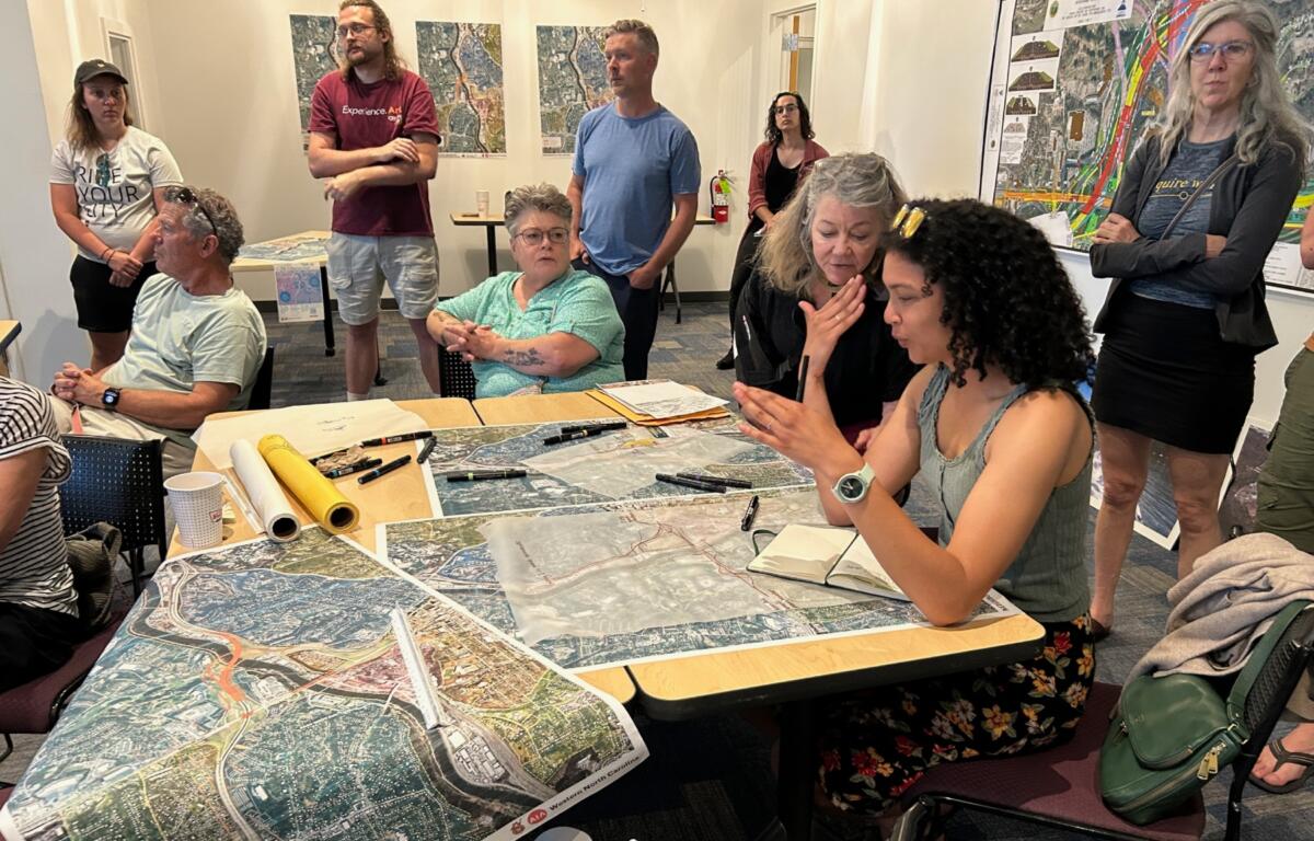 The Western North Carolina chapter of the American Institute of Architects and the I-26 Citizens’ Coalition met May 17 to discuss alternate designs for the Interstate 26 Connector in Asheville. (Photo credit: Sonia Marcus)