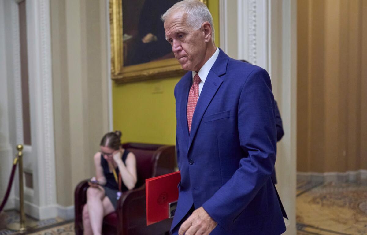 FILE - Sen. Thom Tillis, R-N.C., walks to the chamber as senators arrive for votes and policy meetings, at the Capitol in Washington, June 17, 2025. (AP Photo/J. Scott Applewhite, File)