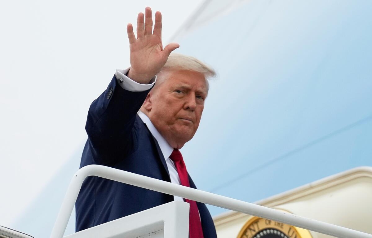 President Donald Trump waves as he boards Air Force One, Sunday, June 15, 2025, at Joint Base Andrews, Md., for a trip to Canada to attend the G7 Summit. (AP Photo/Mark Schiefelbein)