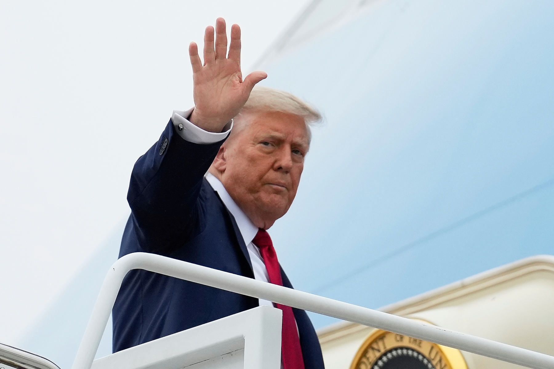 President Donald Trump waves as he boards Air Force One, Sunday, June 15, 2025, at Joint Base Andrews, Md., for a trip to Canada to attend the G7 Summit. (AP Photo/Mark Schiefelbein)