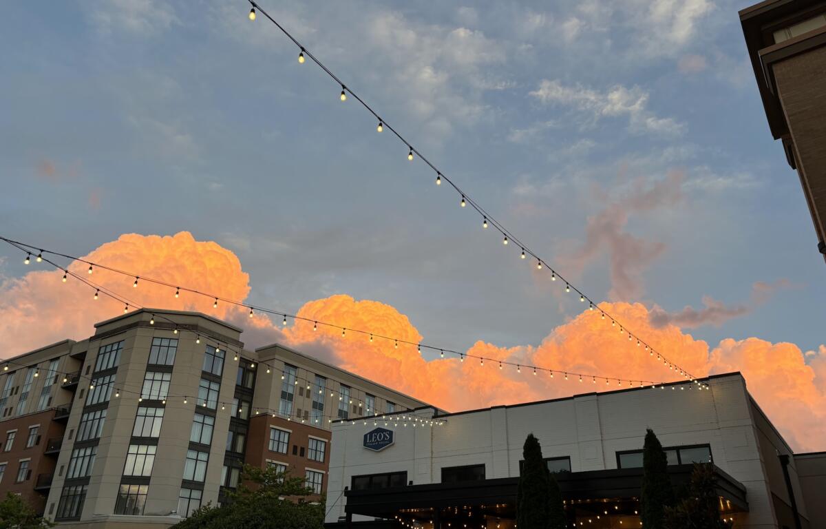 A sunset over buildings in Biltmore Park.