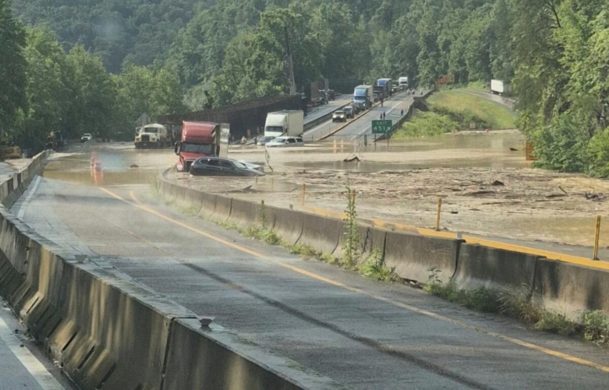 This photo provided by Tennessee Department of Transportation shows Interstate 40 remains closed near the Tennessee-North Carolina state line due to flooding and rockslide on Wednesday, June 18, 2025. (Tennessee Department of Transportation via AP)