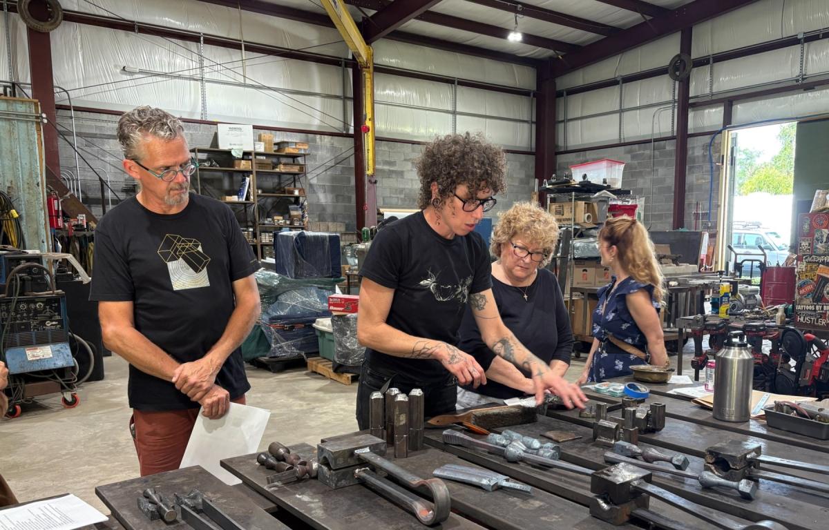 Metal artist Rachel David demonstrates her tools, techniques and artistic process to members of the Asheville Urban Trail Committee and the Public Art & Culture Commission.