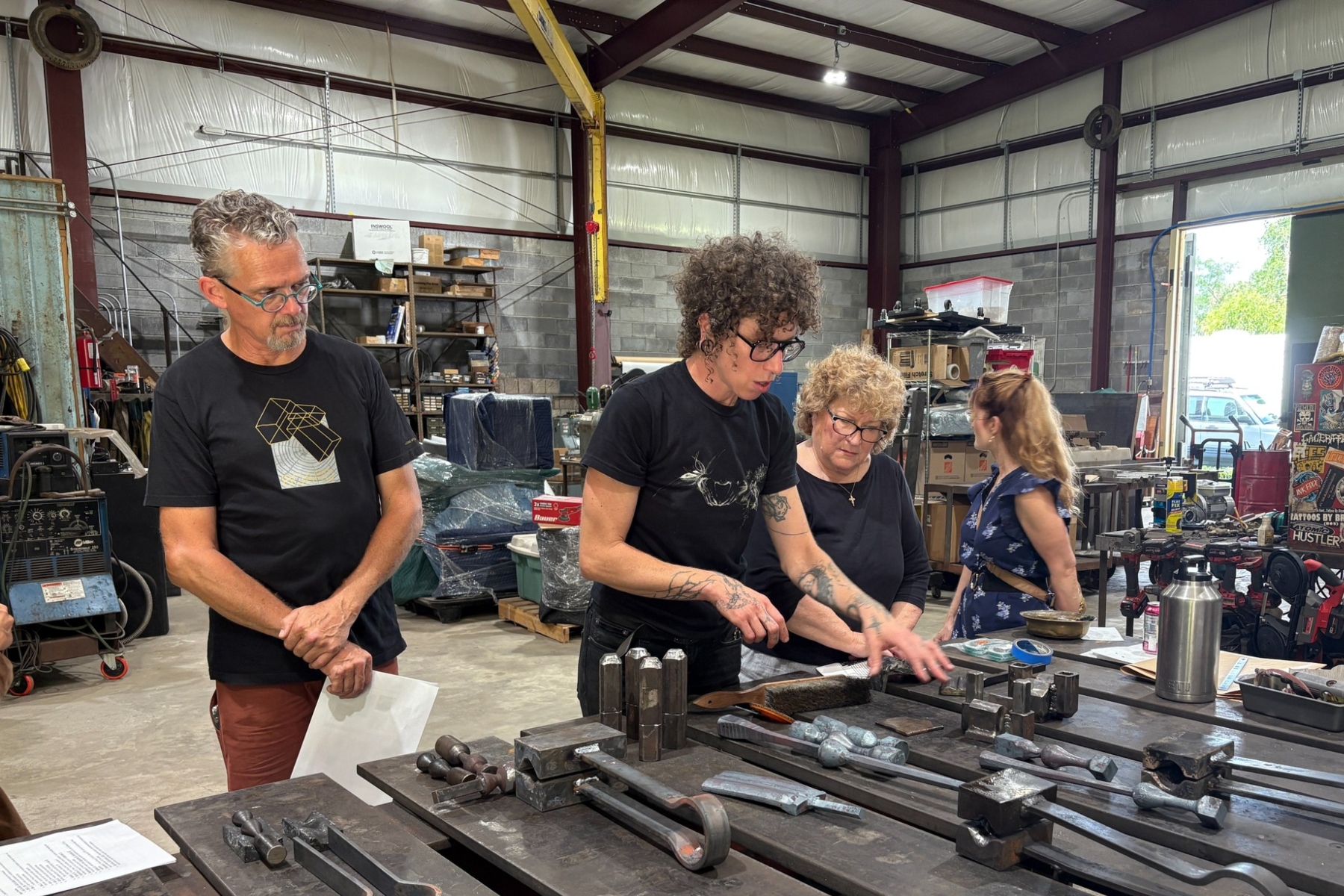 Metal artist Rachel David demonstrates her tools, techniques and artistic process to members of the Asheville Urban Trail Committee and the Public Art & Culture Commission.