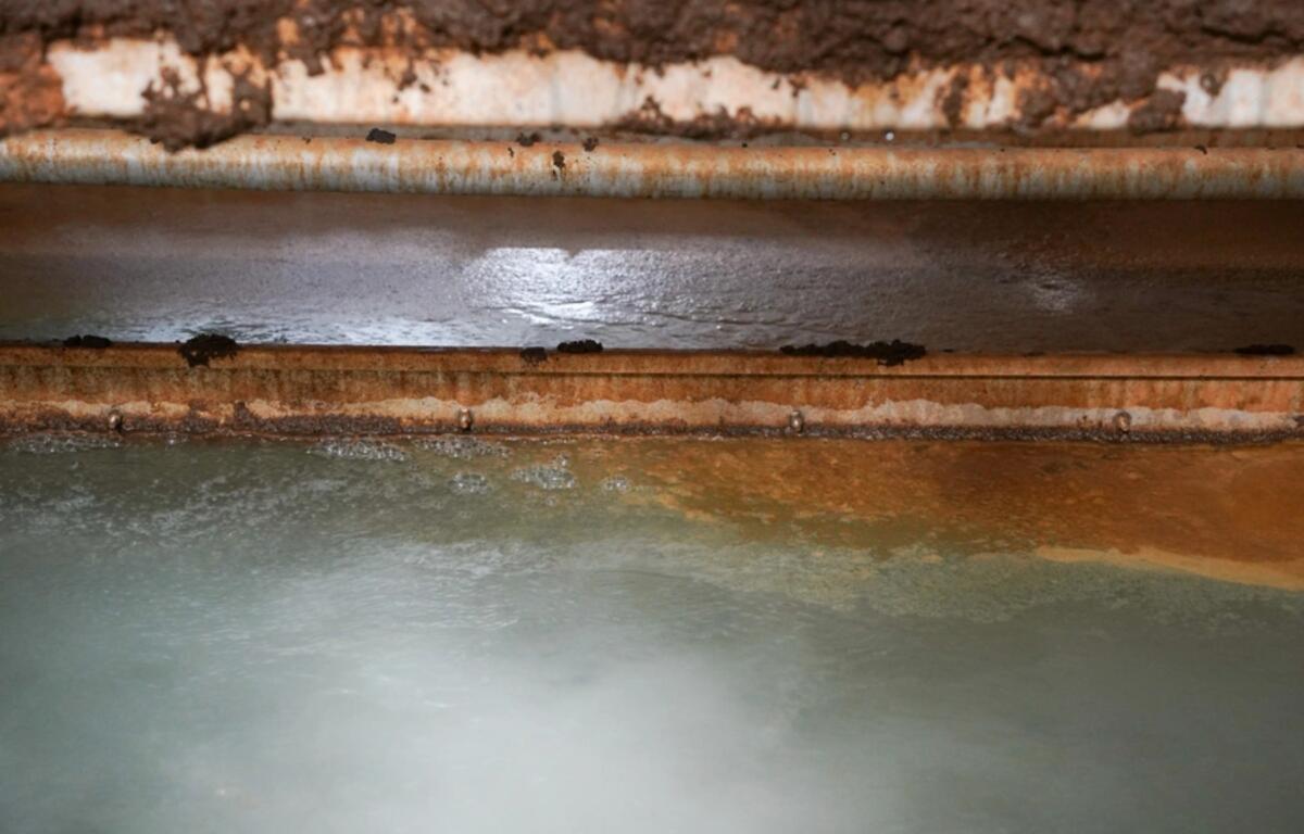 Lake water is treated in a Dissolved Air Flotation (DAF) units where air pushed into the water forcing tiny debris particles to the top of the pool where it’s removed before the water moves on to the next step of filtration. (Photo Credit: Michael Maddox)