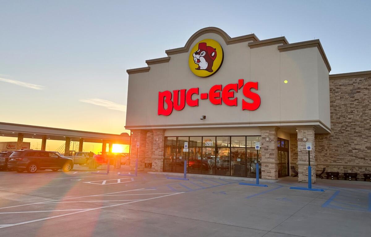 The sun rises beyond the 120 gasoline pumps outside a Buc-ee's store early Thursday, April 4, 2024, in Johnstown, Colo. (AP Photo/David Zalubowski)
