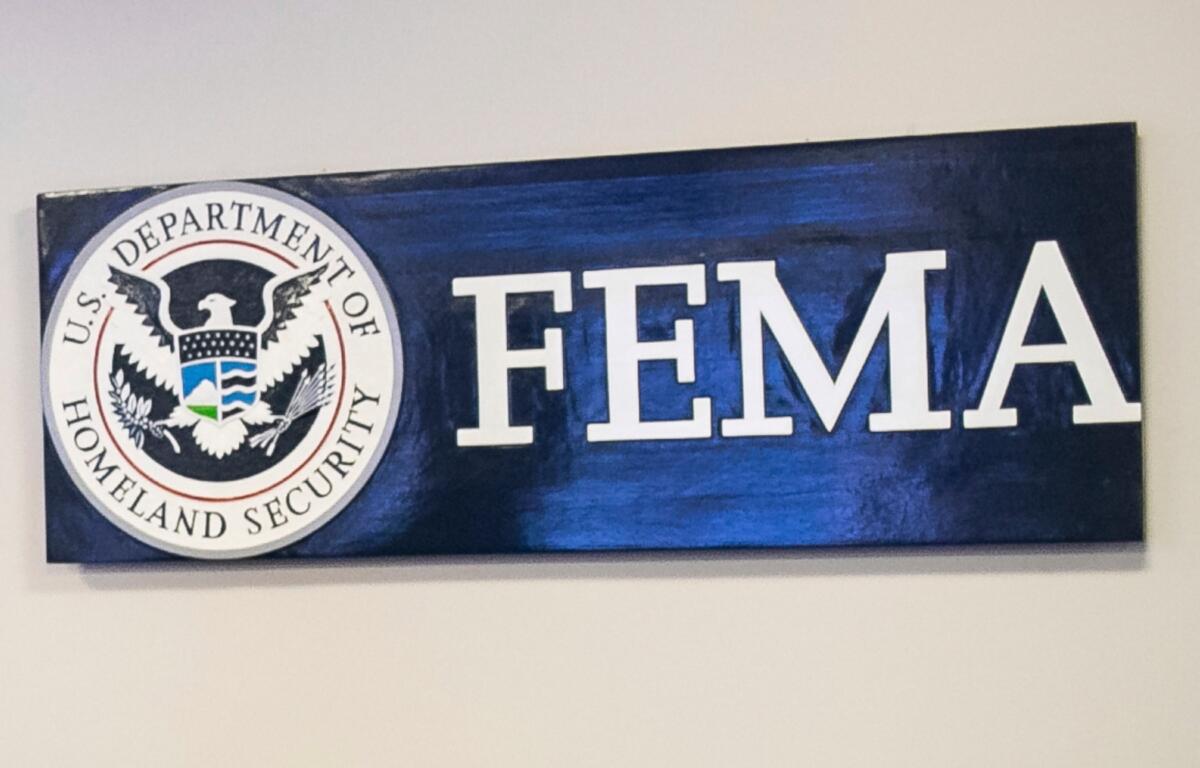FILE - A sign for the Federal Emergency Management Agency is pictured at FEMA headquarters, April 20, 2020, in Washington. (Al Drago/The New York Times via AP, Pool)