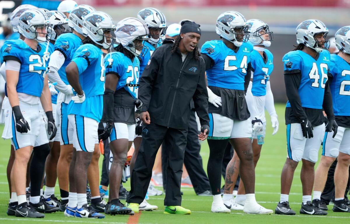 Carolina Panthers cornerback Jaycee Horn watches during an NFL football dual training camp with the Cleveland Browns Wednesday, Aug. 6, 2025, in Charlotte, N.C. Horn was involved in a car accident on his was to camp. (AP Photo/Chris Carlson)