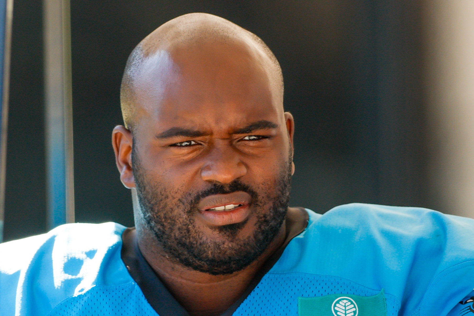FILE - Carolina Panthers tackle Taylor Moton rides in a cart to the team's NFL football training camp in Charlotte, N.C., Saturday, July 26, 2025. (AP Photo/Nell Redmond, FIle)