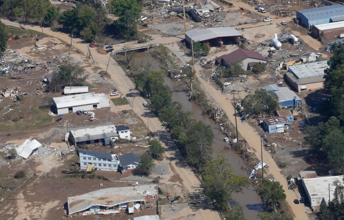 A view of damage in Asheville, N.C., is seen during an aerial tour with President Joe Biden who looked at areas impacted by Hurricane Helene near Asheville, N.C., Wednesday, Oct. 2, 2024. (AP Photo/Susan Walsh)