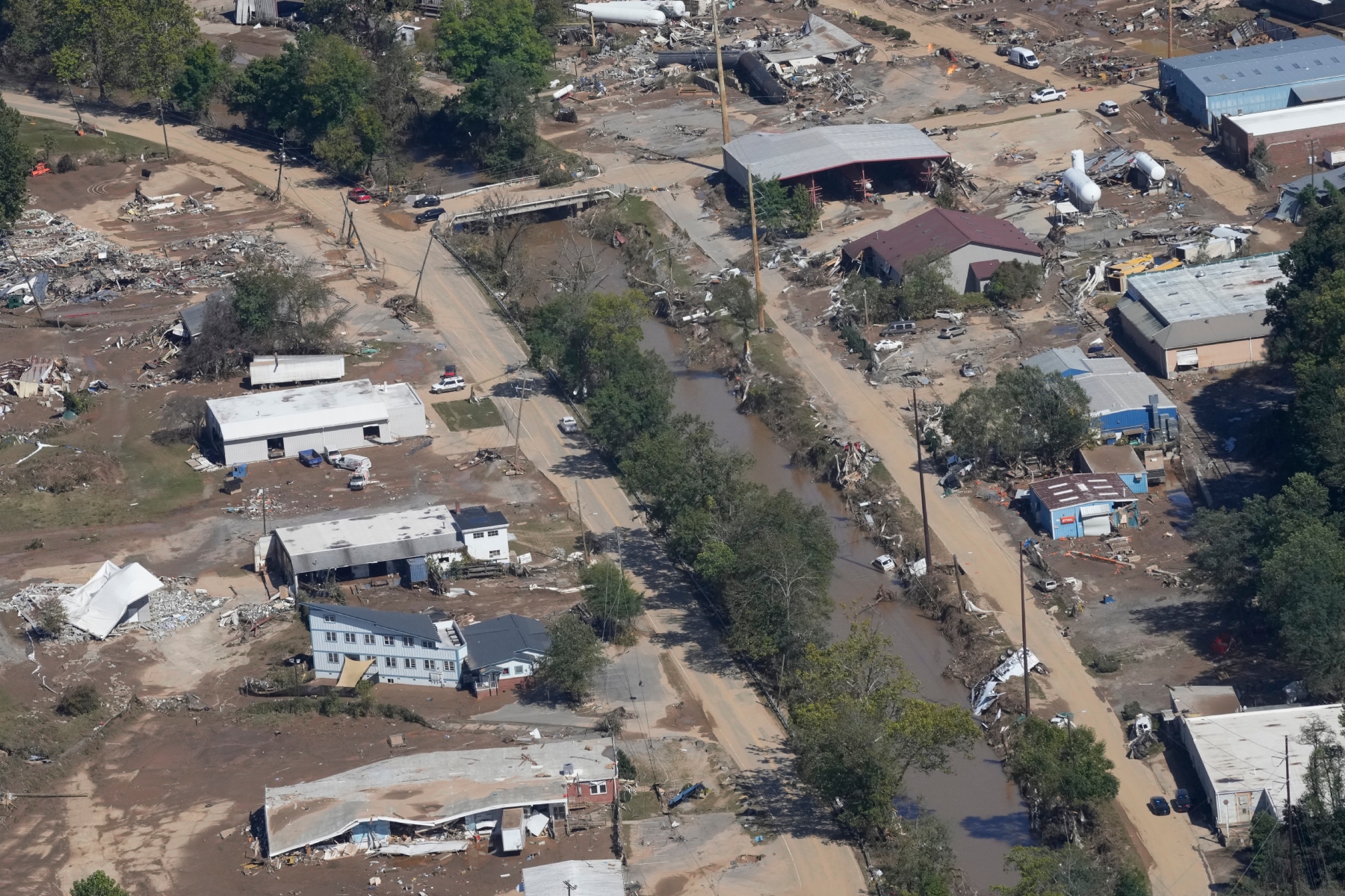 A view of damage in Asheville, N.C., is seen during an aerial tour with President Joe Biden who looked at areas impacted by Hurricane Helene near Asheville, N.C., Wednesday, Oct. 2, 2024. (AP Photo/Susan Walsh)