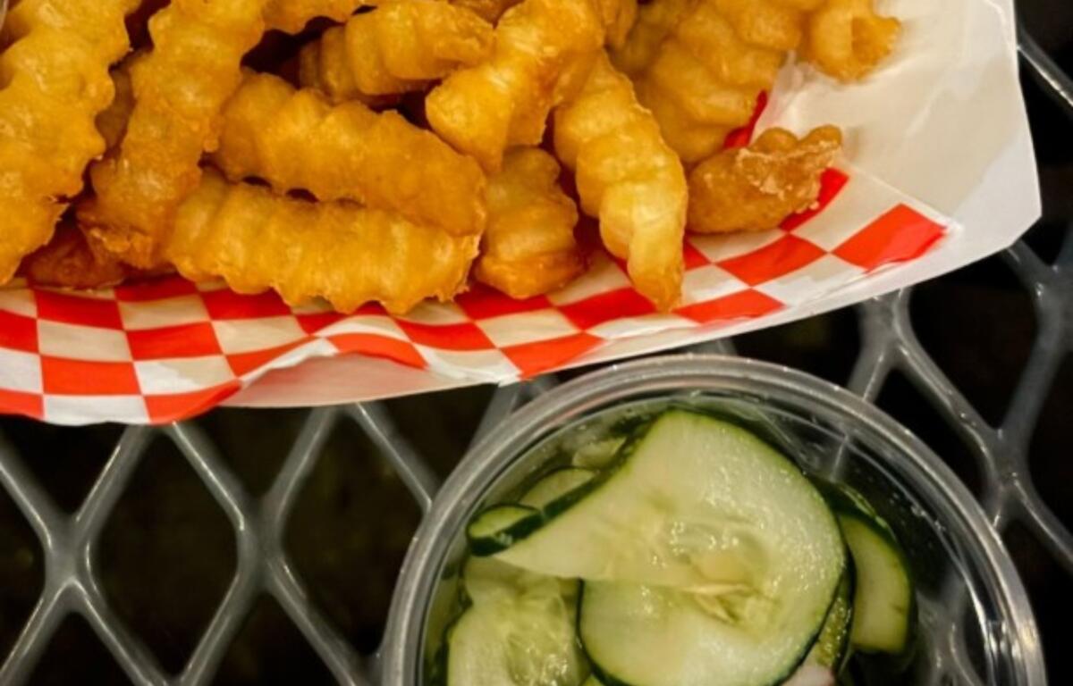 Fork and Dagger crinkle fries and pickles
