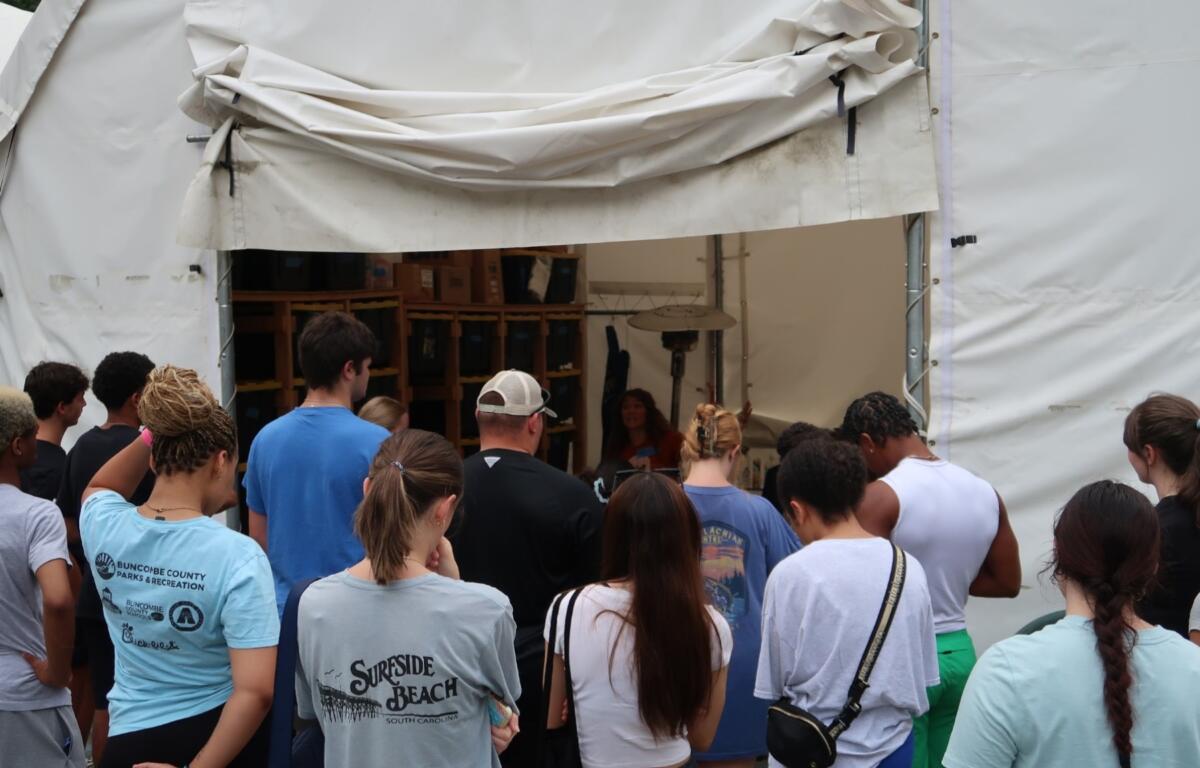 A group of Marshall Relief Alliance volunteers waits for instructions during a workday in August.