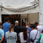 A group of Marshall Relief Alliance volunteers waits for instructions during a workday in August.
