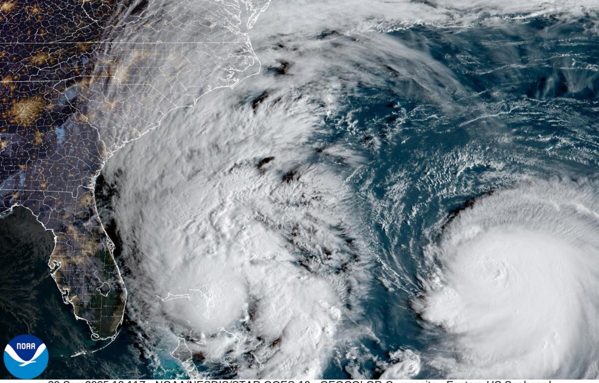A satellite image Monday morning shows clouds extending 1,000 miles from Imelda's center all the way into Central Pennsylvania, while Humberto continues to churn in the Atlantic.