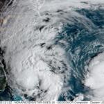 A satellite image Monday morning shows clouds extending 1,000 miles from Imelda's center all the way into Central Pennsylvania, while Humberto continues to churn in the Atlantic.