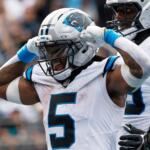 Carolina Panthers running back Rico Dowdle celebrates after scoring against the Miami Dolphins during the second half of an NFL football game, Sunday, Oct. 5, 2025, in Charlotte, N.C. (AP Photo/Jacob Kupferman)