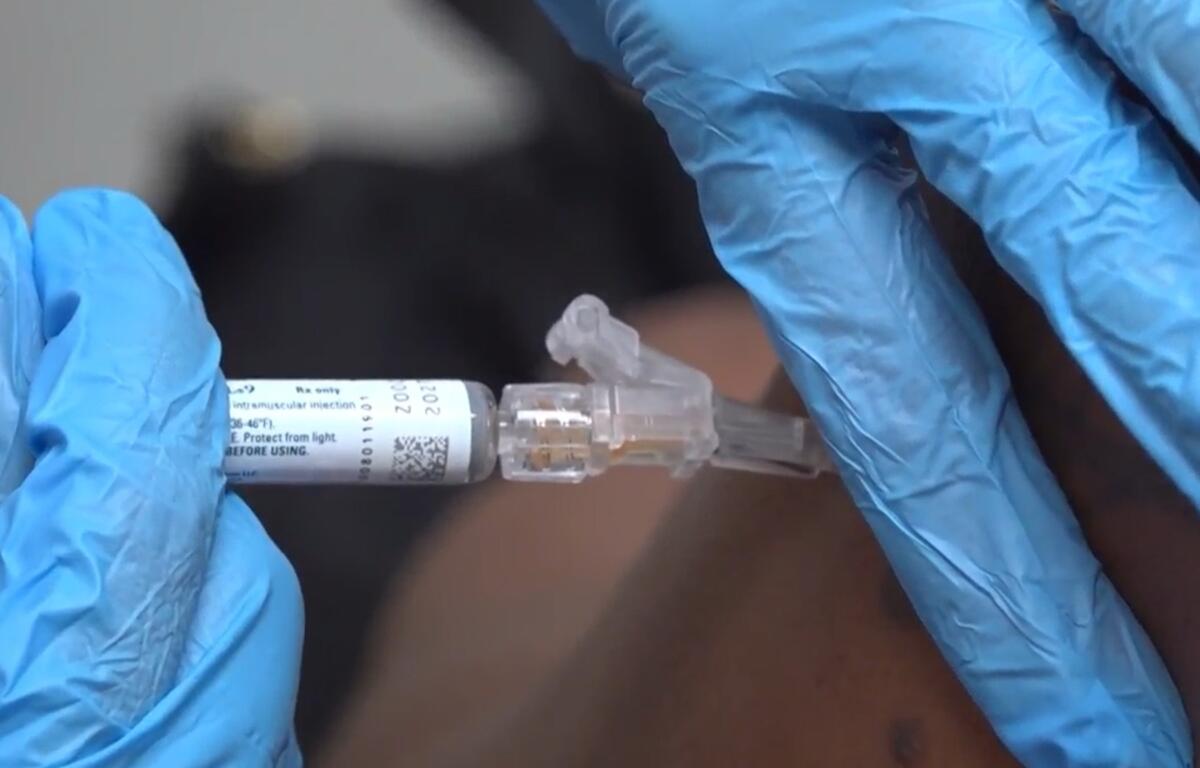 A pharmacist gives a patient a flu shot in Miami on Sept. 9, 2025. (AP Photo/Daniel Kozin)