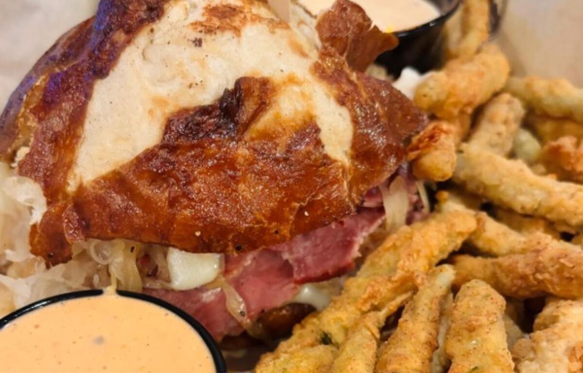 Lucy's Reuben -- a house-made corned beef and turkey, topped with Swiss cheese, sauerkraut on a pretzel bun -- was served with a side of thousand island dressing.