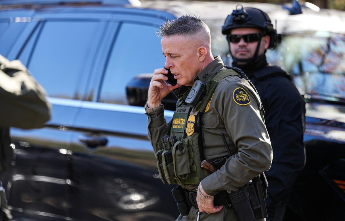 U.S. Border Patrol Commander at large Gregory Bovino takes a phone call, Monday, Nov. 17, 2025, in Charlotte, N.C. (AP Photo/Matt Kelley)