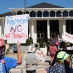 FILE - Demonstrators approach the Legislative Building during a rally protesting a proposed election redistricting map, Oct. 21, 2025, in Raleigh, N.C. (AP Photo/Chris Seward, File)