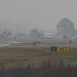 First responders tend to the scene of a reported plane crash at a regional airport in Statesville, N.C., Thursday, Dec. 18, 2025. (AP Photo/Matt Kelley)