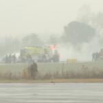 This screengrab made from video provided by WSOC shows firefighting crews responding to a reported plane crash at a regional airport in Statesville, N.C., erupting in a large fire, Thursday, Dec. 18, 2025. (WSOC via AP)