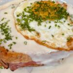 Croque Madame, a traditional sandwich of ham, gruyere cheese and Mornay sauce with an egg on top