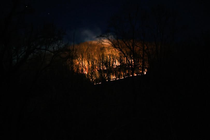 Firefighters had a wildfire burning off Lytle Cove Road about 70% contained by early Friday morning, according to Swannanoa Fire & Rescue.