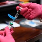 FILE - Anna Hicks prepares a measles, mumps and rubella vaccine at the Andrews County Health Department, Tuesday, April 8, 2025, in Andrews, Texas. (AP Photo/Annie Rice, File)